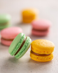 Macarons on light background.Colorful small cookies of different tastes from ground almonds