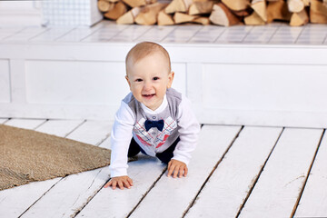Toddler crawls across floor on all fours and smiles.