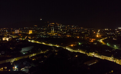 Fototapeta na wymiar The town of Vršac at night. Aerial photography. 