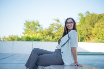 Smiling business girl with glasses