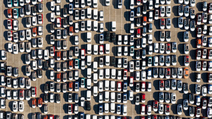 Odessa, Ukraine - August 11, 2021: Aerial view from drone to automobile customs terminal. Large number of cars at customs terminal are awaiting shipment. Accumulative customs platform for cars.