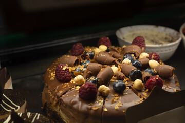 Oreo cookie cake with caramel. Brown tasty sweet pie. Peanut biscuit cake.