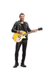 Smiling male musician with a yellow electric guitar