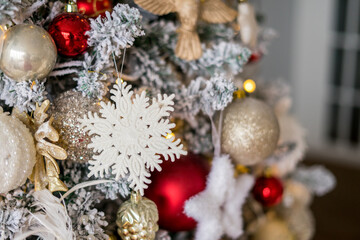 Beautiful Christmas tree with festive decor, close-up. Christmas tree decorated with balls close up. New Year