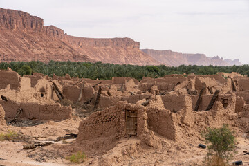 The old clay houses of Tabuk between the green palm grove, Saudi Arabia