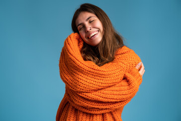 I love myself. Portrait of pleased satisfied girl hugging herself and smiling, feeling comfortable...