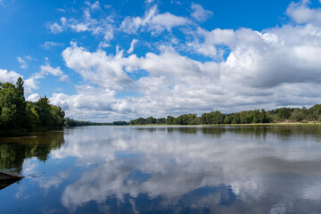 Obraz na płótnie Canvas White clouds over the river Loire in France