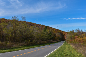 Winding Country Road Traveling Through Beautiful Fall Foliage