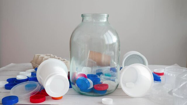 sorting plastic drink bottle caps and lids for recycling. Waste sorting and recycle. Zero waste lifestyle. Time lapse