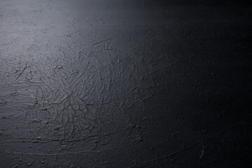 45 degree view, cracked black surface background