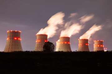 nuclear power plant at night. Air emissions