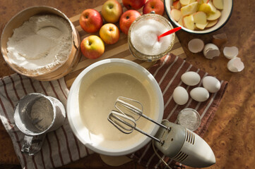 Prepared beaten eggs with a mixer, for making delicious and airy apple biscuit.