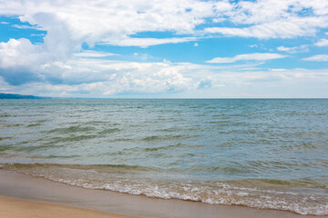 Beautiful view of beach, sea and blue cloudy sky