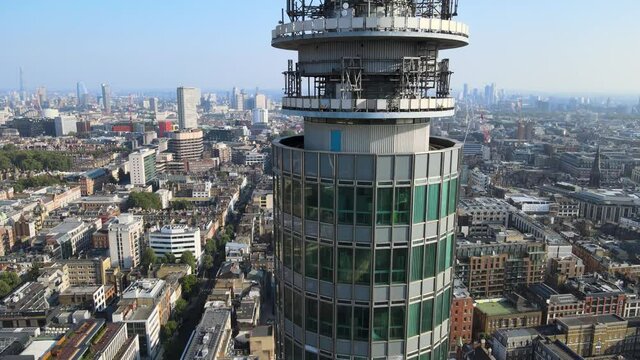 antennas and windows at tall telecommunication BT tower. Cityscape in background