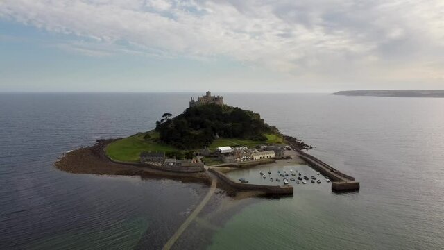 St Michael's Mount near Penzance in Cornwall, England Drone Aerial View - Slow Moving Away Coast-side