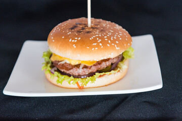 Burger on a black background.