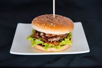 Burger on a black background.