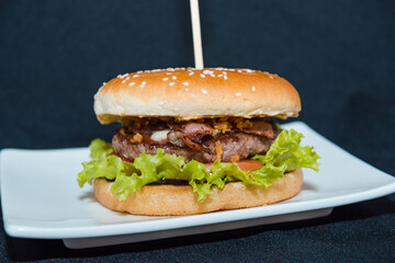 Burger on a black background.