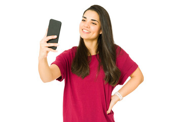 Fototapeta premium Influencer recording a video with her phone