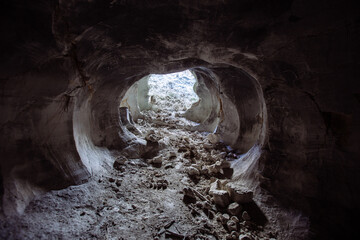 Artisanal chalk mining. Old small abandoned adit