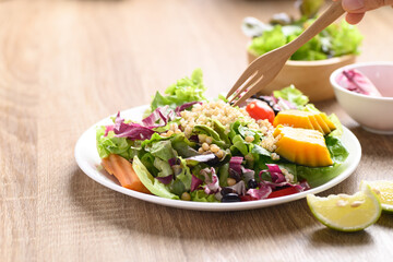 Fresh organic vegetables with quinoa salad on wooden background ready to eating, Healthy Vegan food