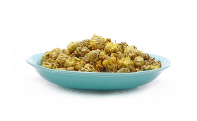 Chrysanthemum tea in ceramic dish isolated on white background. Chrysanthemum tea is a flower-based infusion beverage made from chrysanthemum flowers which are most popular in East and Southeast Asia