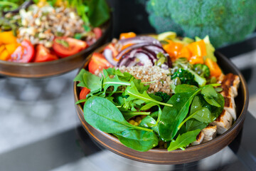 Delicious salad with chicken, tomatoes, beans and arugula. Healthy eating