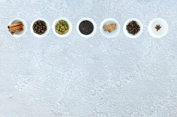Ingredients for Indian masala tea on gray background. High quality photo
