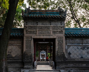 Stone gate and wall at Historic Great Mosque in Chinese style at Muslim Quarter, Xi'an, Shaanxi, 
china, first build in 8th Century. Heirtage and tourist attraction.
