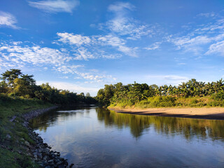 Fototapeta na wymiar River Landscape with blue sky and reflection.