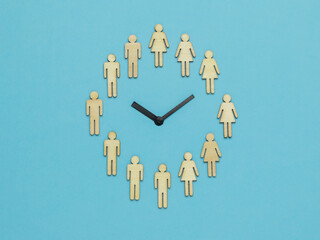 The clock is half of female and half of male figures on a blue background. The concept of periodic...