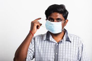 Asian happy portrait young black man wearing face mask protective from virus coronavirus epidemic or air pollution looking camera, studio shot isolated on white background, stop COVID-19 concept