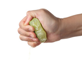 Hand squeeze green lime on white background