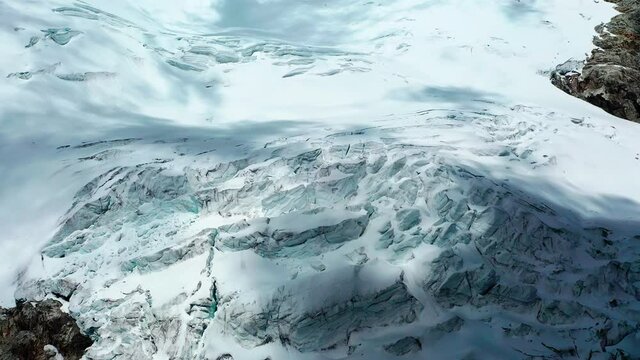 Flying towards a glacier in the Andes of Peru to view a glacier that is melting and shrinking doe to global warming