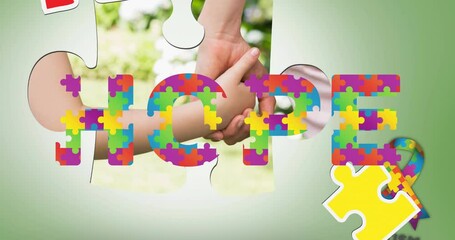 Animation of autism colourful puzzle pieces forming and hope text over mother and child - Powered by Adobe