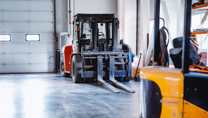 Industrial yellow forklift in warehouse Logistics store