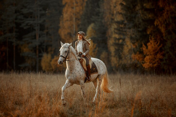 Beautiful young woman in English hunter wear style with Knabstrupper horse and Irish setter at autumn park - 469624452
