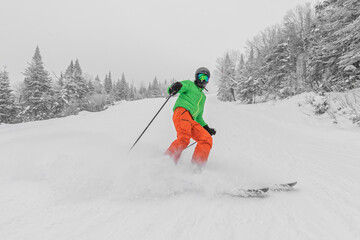 Skiing. Man on ski in Alpine ski concept - Skier skiing downhill doing hockey stop at mountain snow...