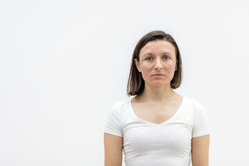 Photo of woman looking at camera on white background.
