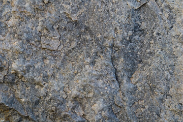 Natural gray stone as a background or texture seamless for design. High quality photo