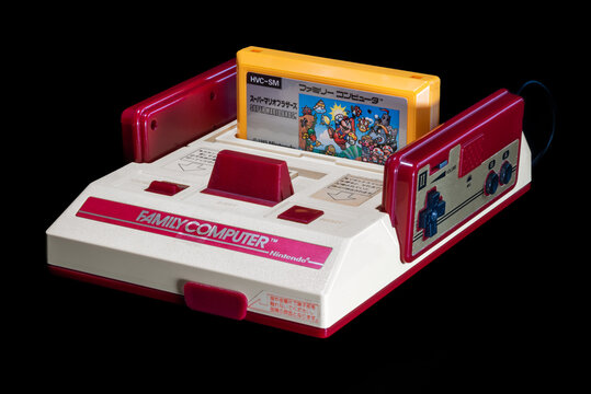 Fukuoka, japan - november 17 2021 : the famous nintendo 1985's hit super mario bros game plugged in the original japanese nintendo entertainment system family computer famicom 