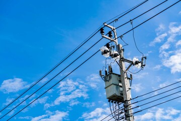 Electric pole and blue sky. Power and energy. Three-phase electric power for transfer power by...