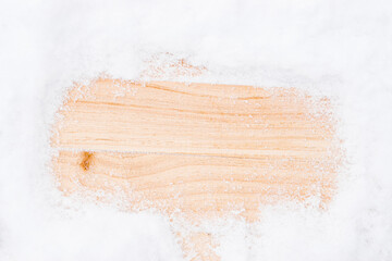 Winter wood. Christmas board with old rustic wall, white frozen snow . Winter wooden texture background. inimal flat lay.