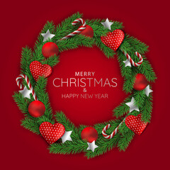 Christmas holidays. Christmas wreath on red background.
