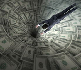 Businessman fighting against dollar funnel