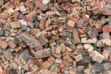 A pile of broken yellow and red bricks