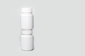 white plastic medicine bottle blank label with copyspace isolated on white background