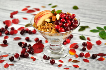 Granola with yogurt and berries for healthy breakfast on a table.
