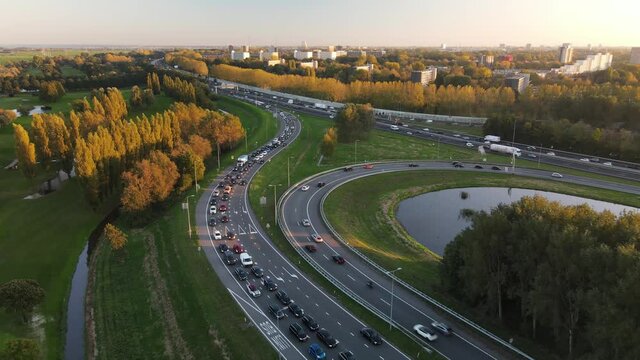 Amsterdan north intersection between N247 and the A10 Ringweg north, the highway where evening rush hour traffic stands on the highway. Commuters going home.