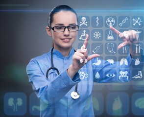 Woman doctor pressing buttons with various medical icons